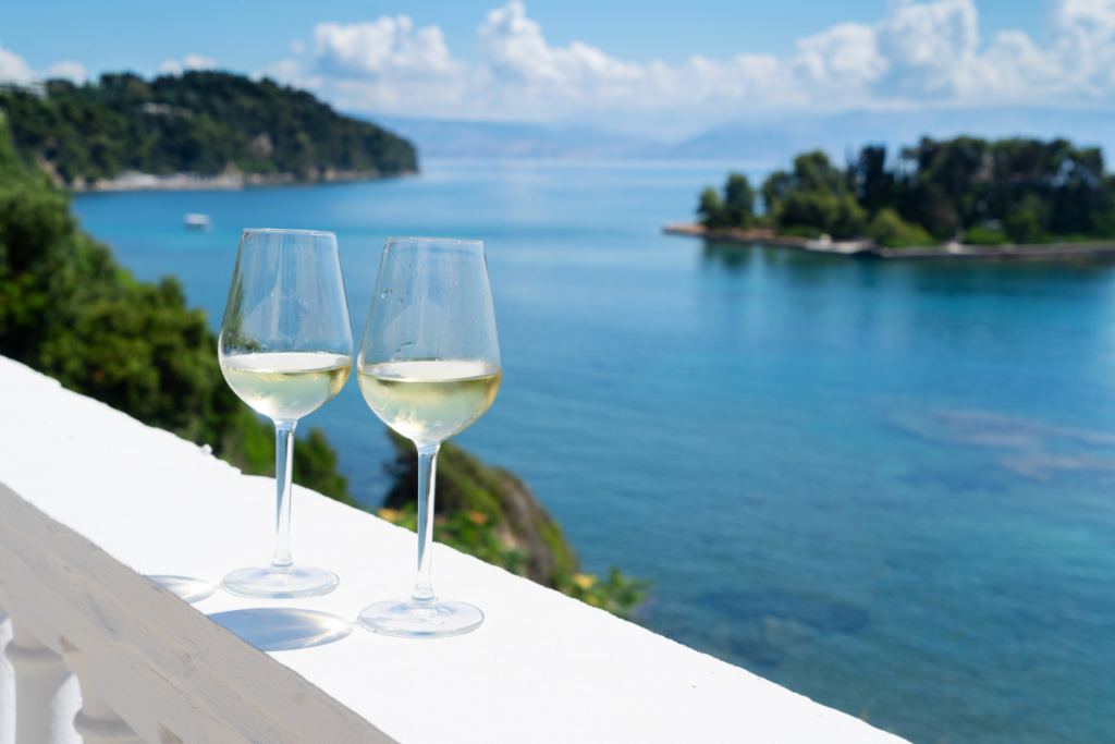 Two glasses of wine on Corfu overlooking the water