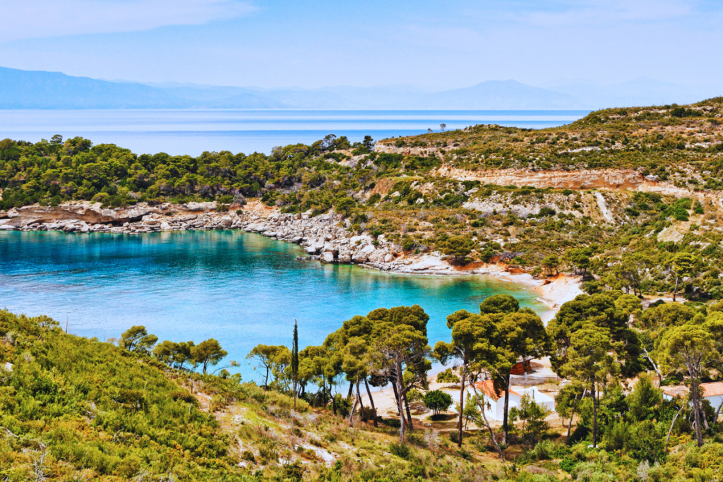 Agia Paraskevi beach on Spetses, beach surrounded by a forest