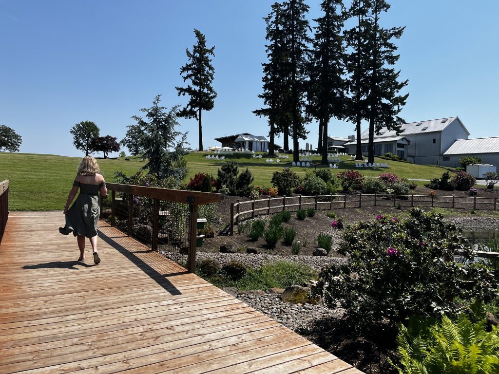 How to save money wine tasting-girl walking around at a local winery.